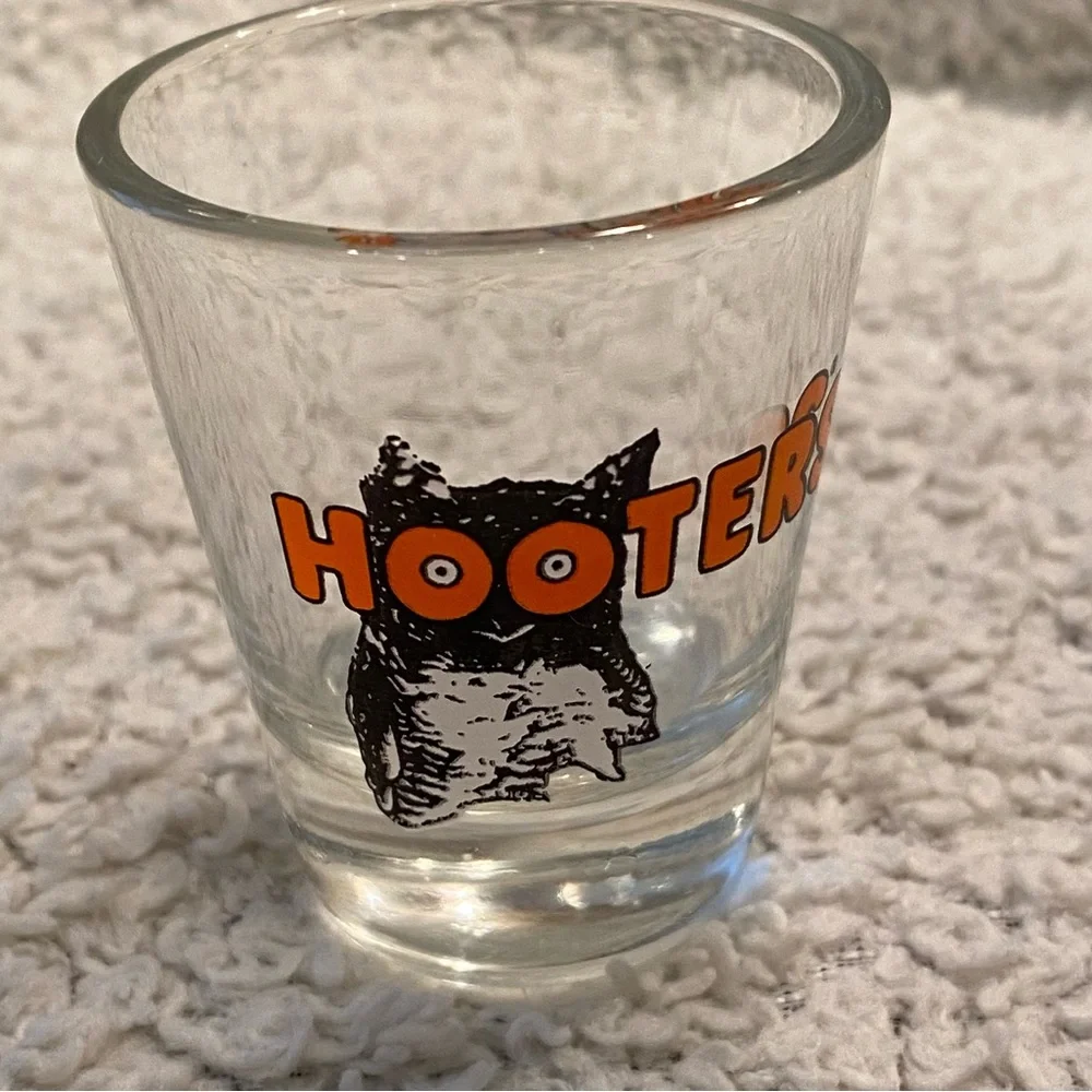 Hooter’s shot glass,  white orange with owl logo, no city specified